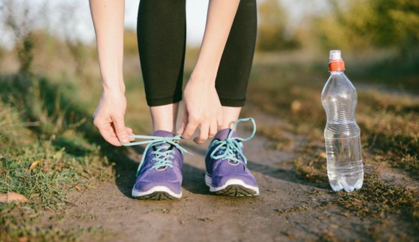 A person tying their shoes.