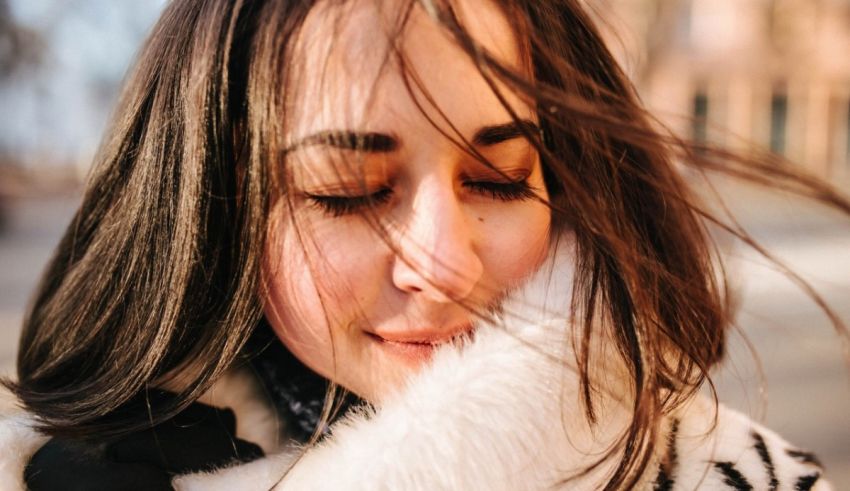 A woman with her eyes closed.