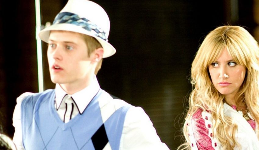 A man in a hat and a woman in a dress.