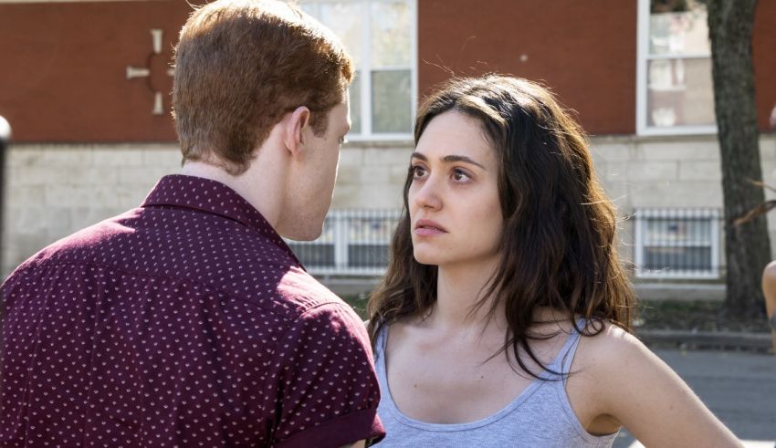 A young man and a young woman standing next to each other.