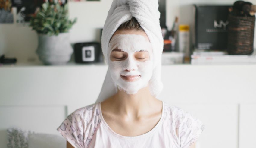 A woman with a facial mask on her face.