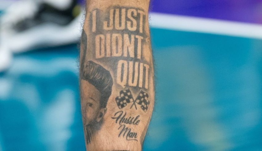 A tattoo on a man's arm that says i just didn't out.