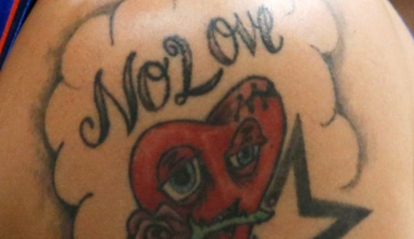 A tattoo of a heart with a star on it.