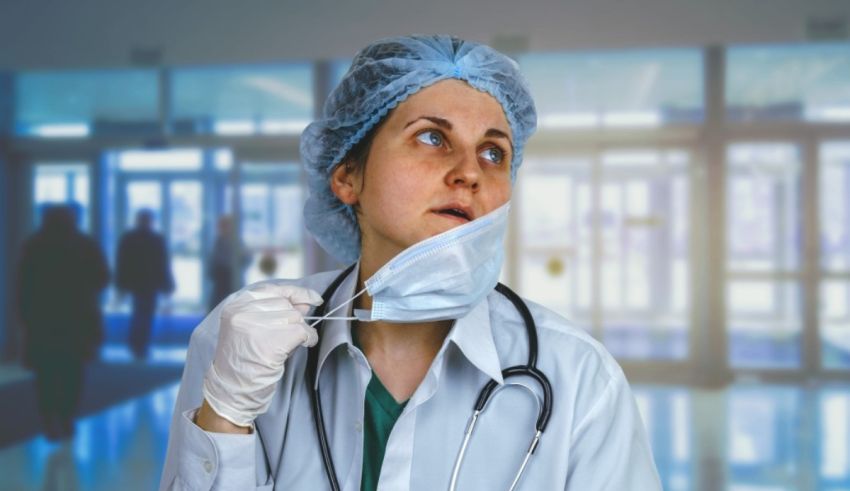 A female doctor with a stethoscope in her mouth.