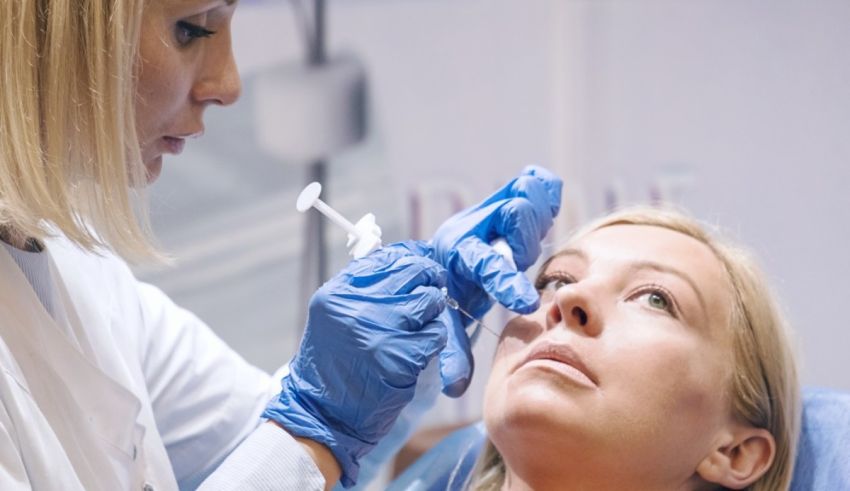 A woman is getting her eyes examined by a doctor.