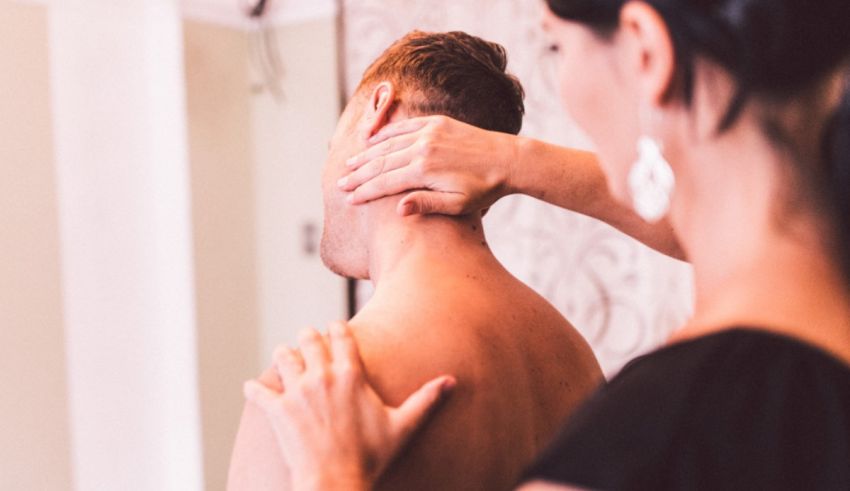 A man is getting a massage on his neck.
