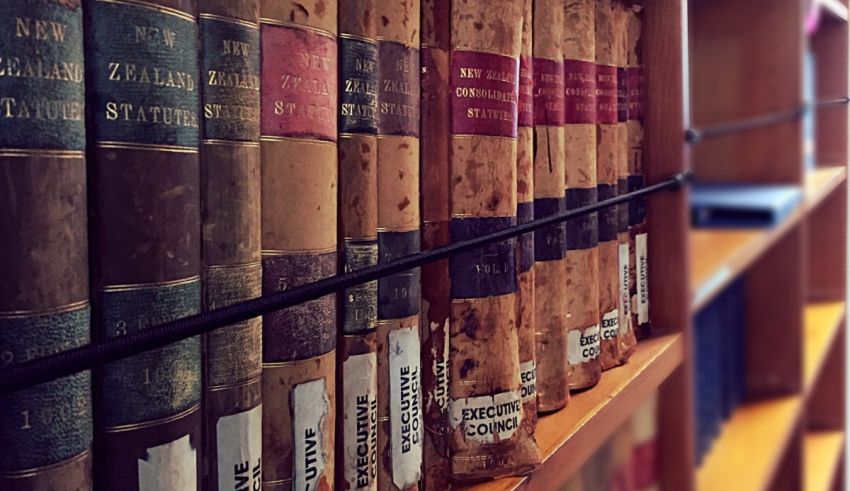 A row of books on a shelf in a library.