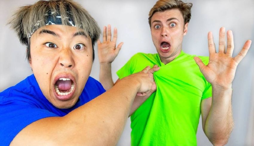 Two men are making faces at each other.