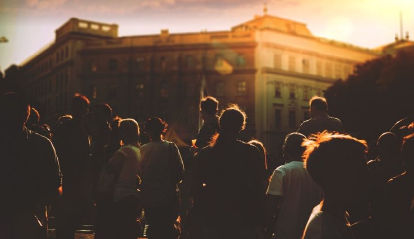 A group of people standing in front of a building.