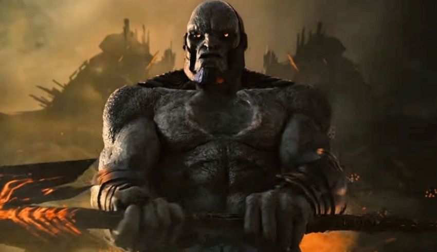 An image of a demon holding an axe in front of a fire.