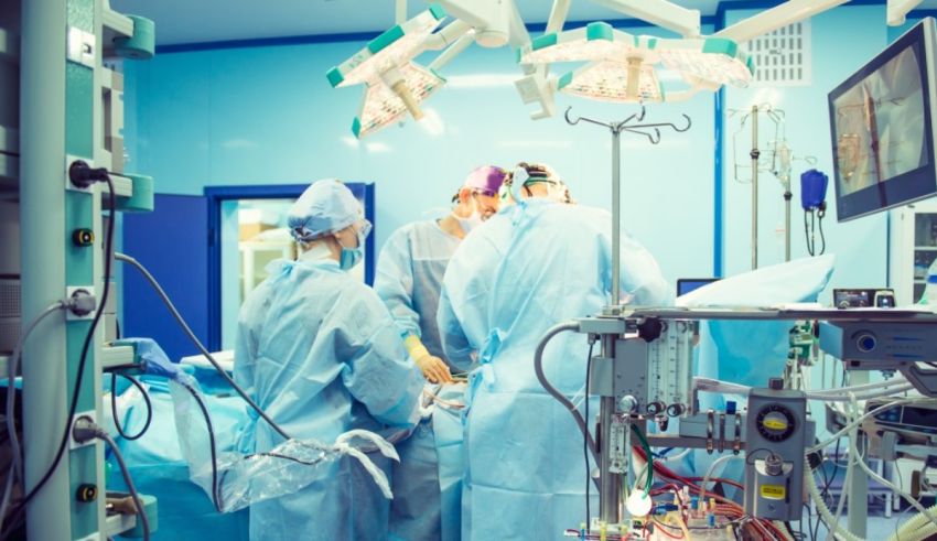 A group of surgeons working in an operating room.