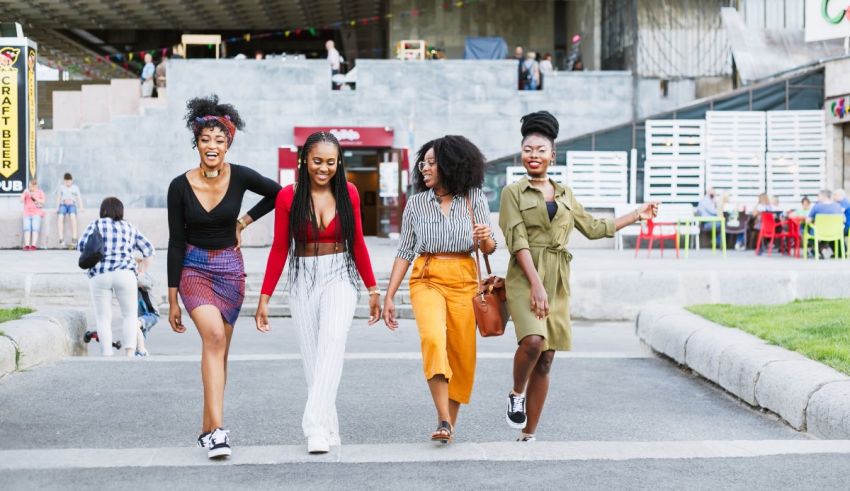 A group of young women walking down a street.