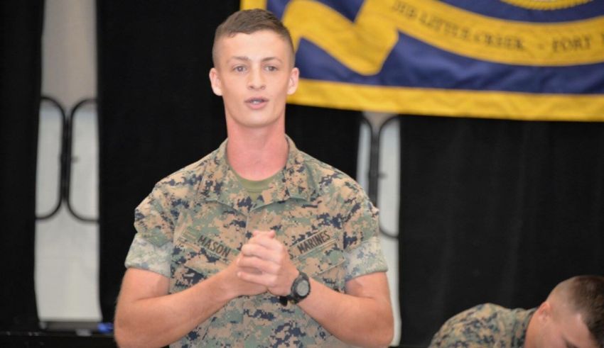 A man in a military uniform is giving a speech.