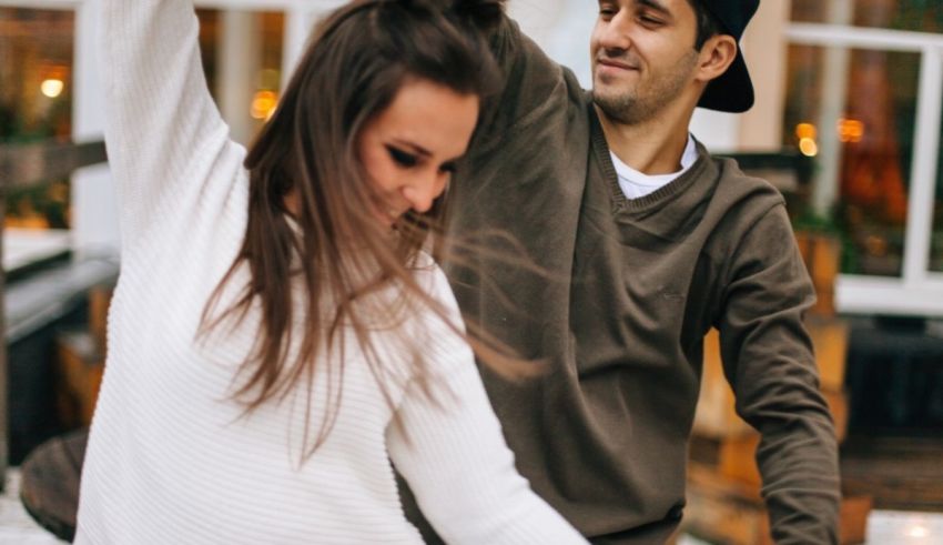 A man and woman dancing on a dance floor.