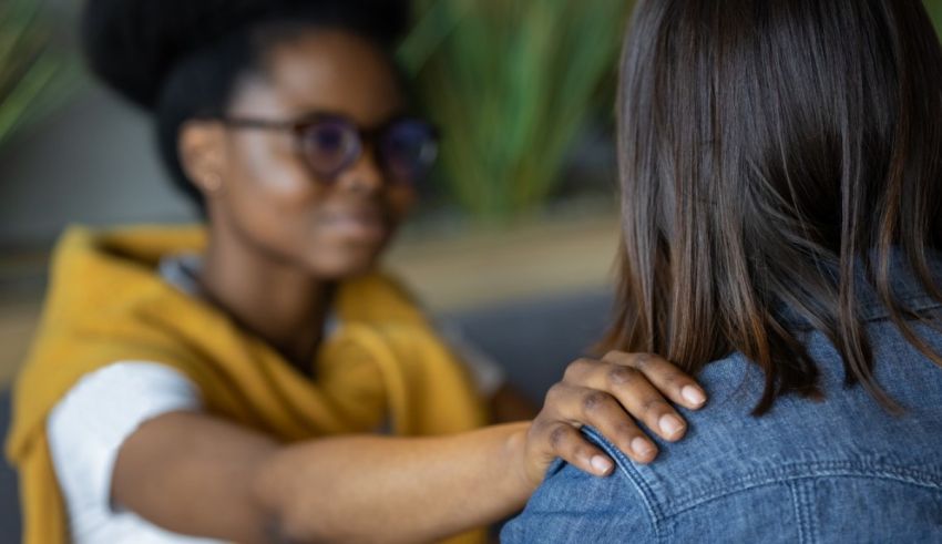 A woman is holding another woman's hand.