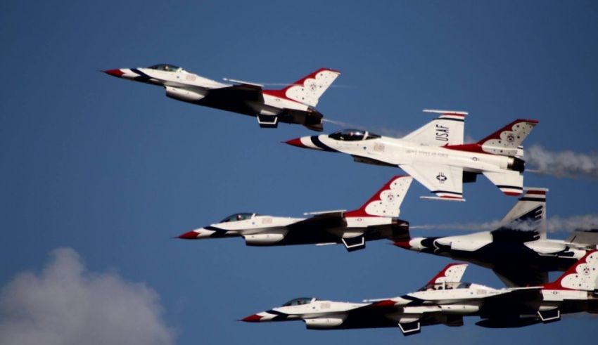 A group of fighter jets flying in formation.