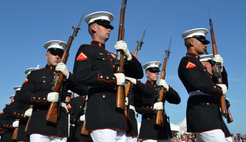 A group of marines in uniform with rifles.