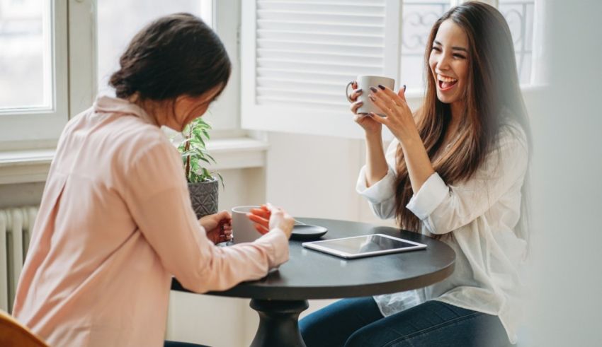 Two women sitting at a table.
