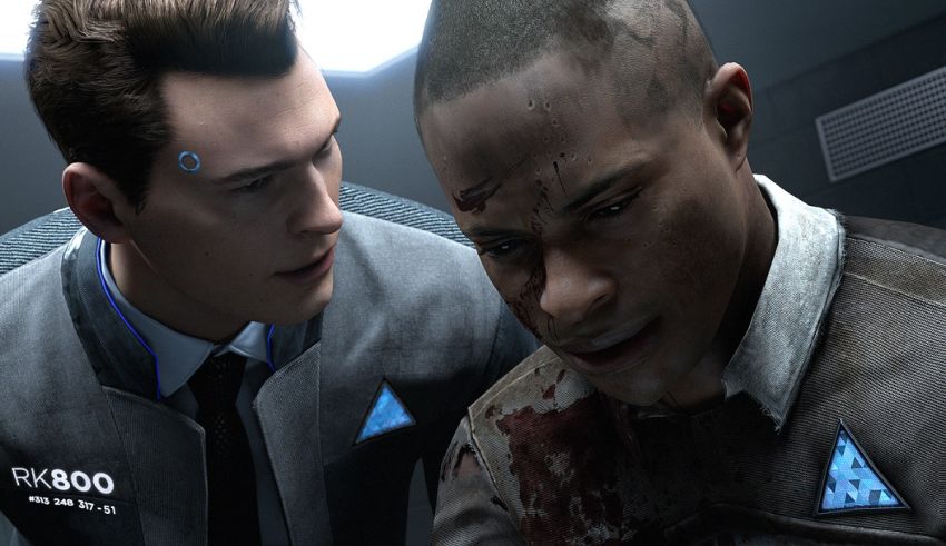 Two men are standing next to each other in a dark room.