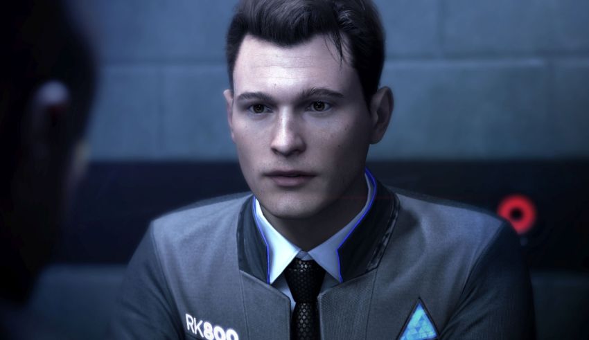 A man in a suit is talking to another man.