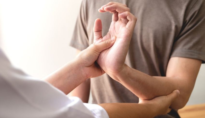 A man is putting his hand on a man's wrist.