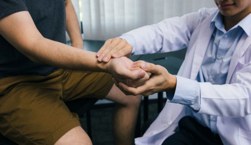 A doctor is examining a patient's wrist.