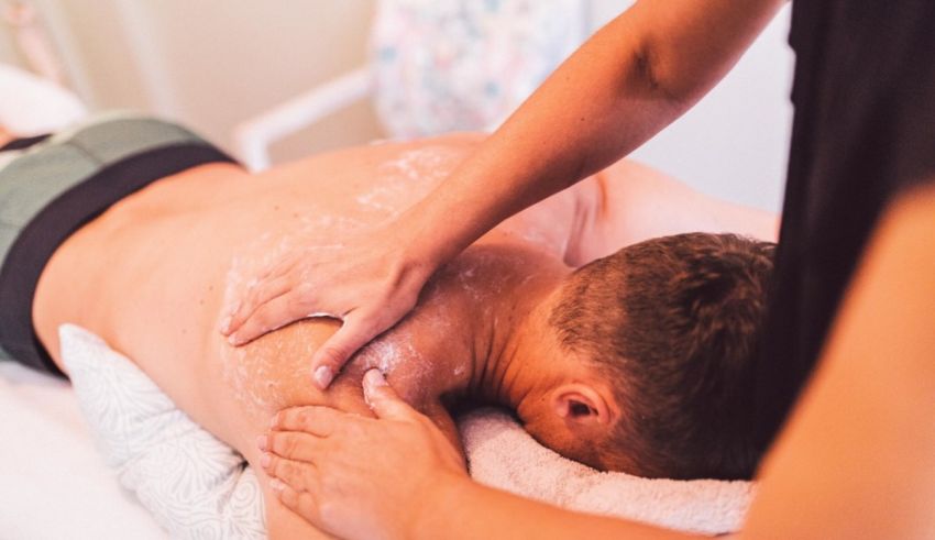 A man getting a back massage in a hospital.