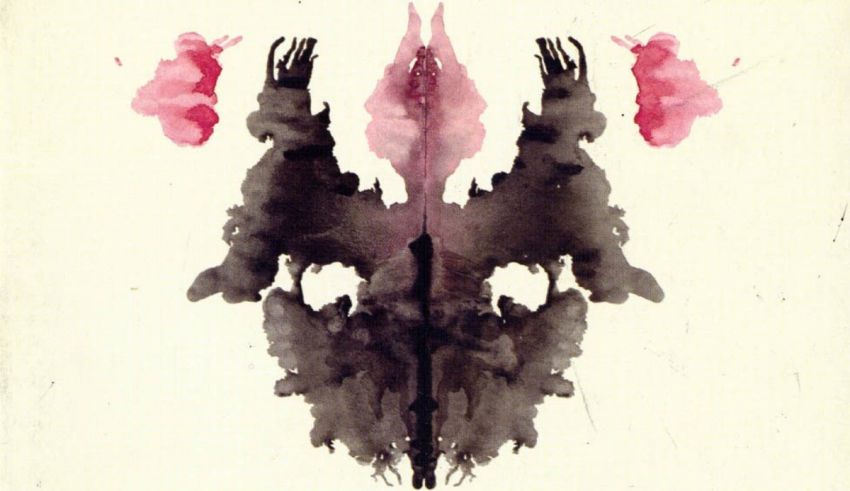 A black and pink ink blot on a white background.