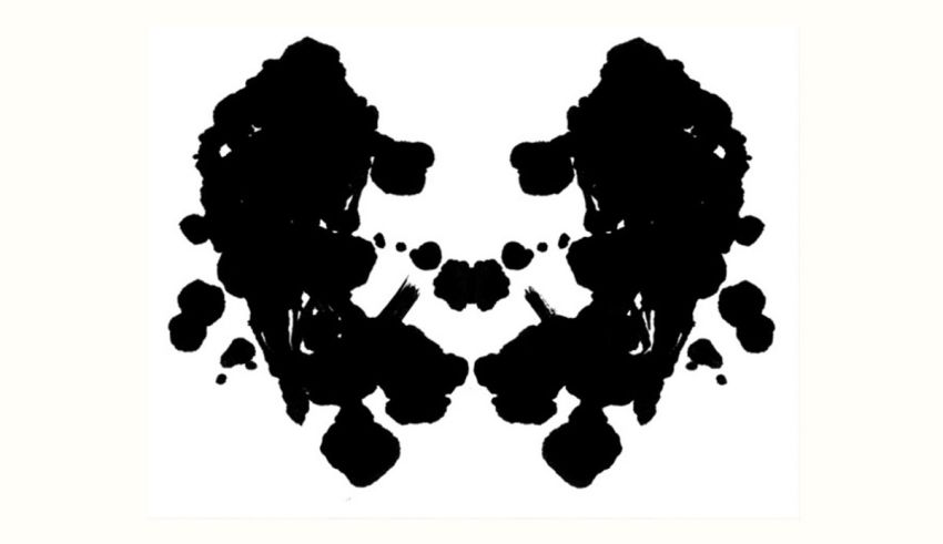 A black and white ink blot on a white background.