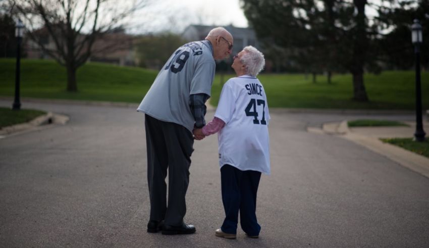 A couple holding hands in the middle of a road.