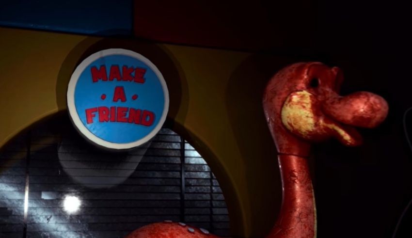 A red flamingo standing next to a sign that says make a friend.