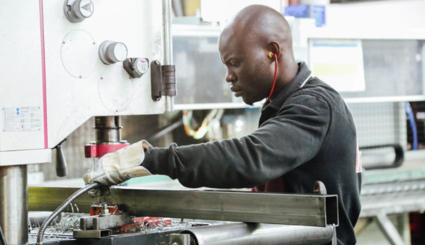 A man working on a machine in a factory.