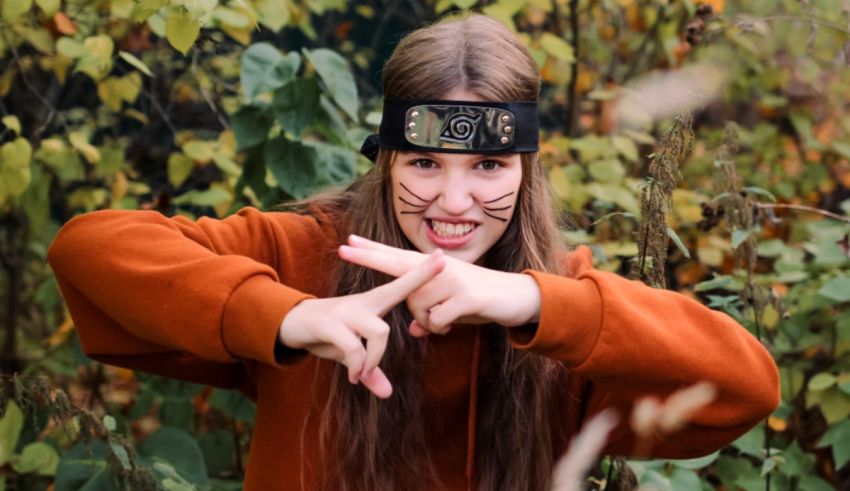 A girl wearing a ninja headband posing for the camera.