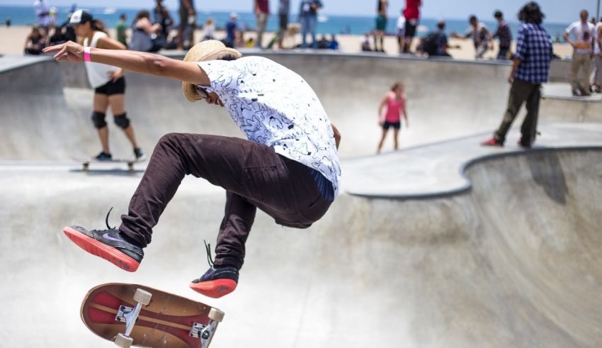 A skateboarder doing a trick in a skate park.