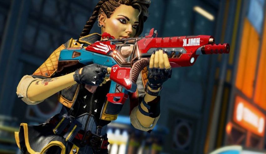 A woman holding a gun in a city.