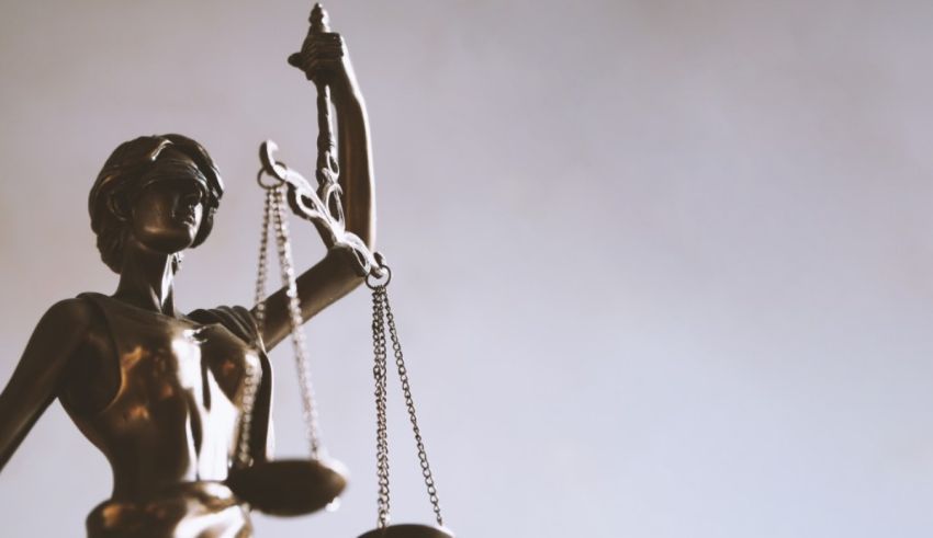 A statue of justice holding scales of justice.