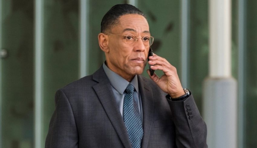 A man in a suit and tie talking on a cell phone.