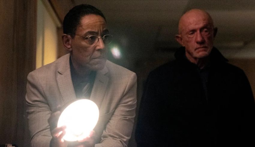 Two men standing in a hallway with a ball in their hands.