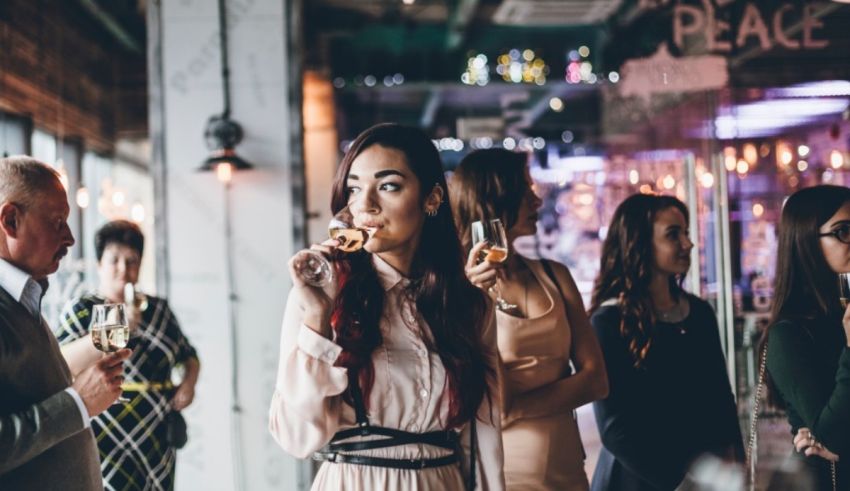 A group of people drinking wine at a party.