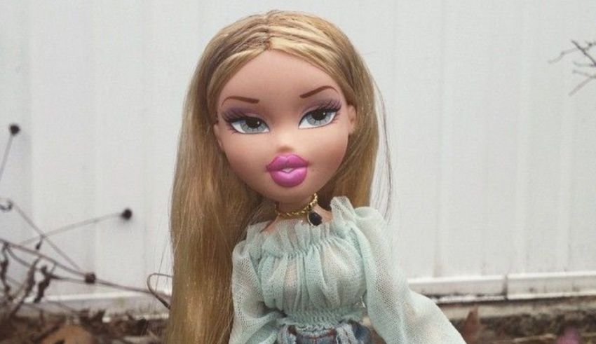 A doll with long blonde hair and blue jeans.