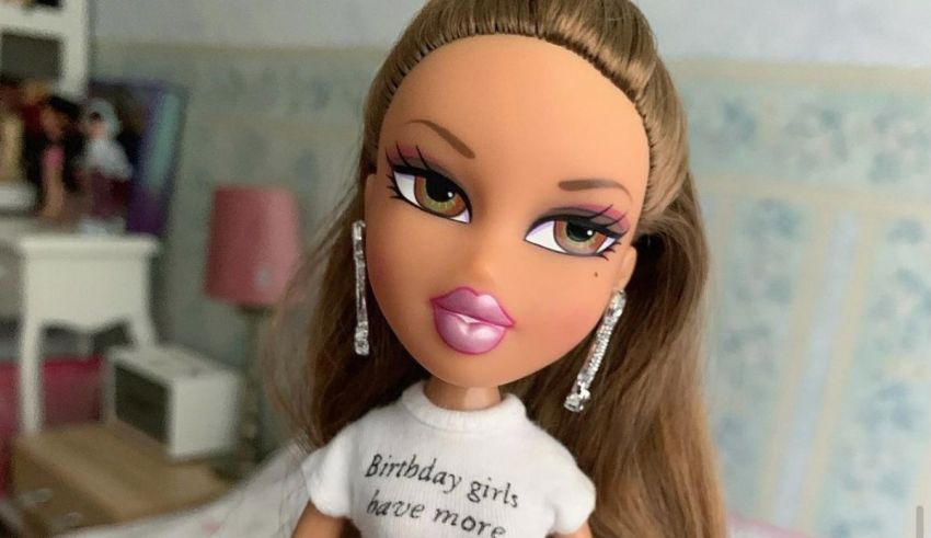 A doll wearing a t - shirt with a birthday message.