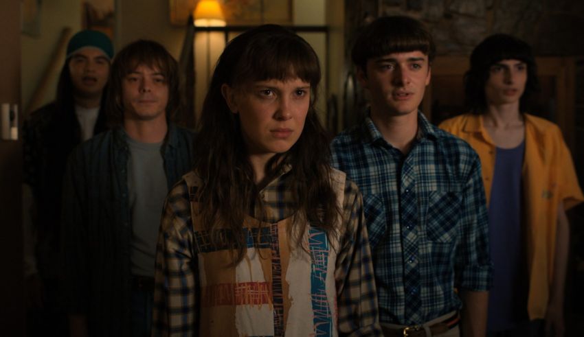 A group of people standing in a room.