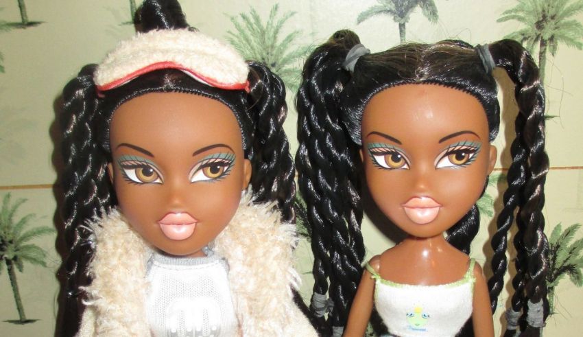 Two black dolls standing next to each other.