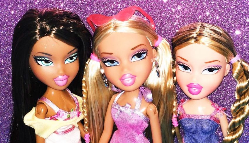 Three barbie dolls are posing in front of a purple background.