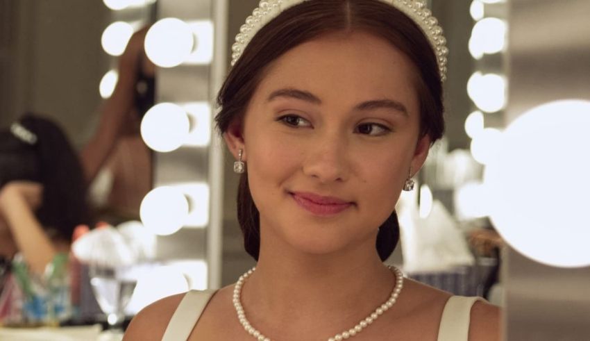 A young woman in a white dress in front of mirrors.