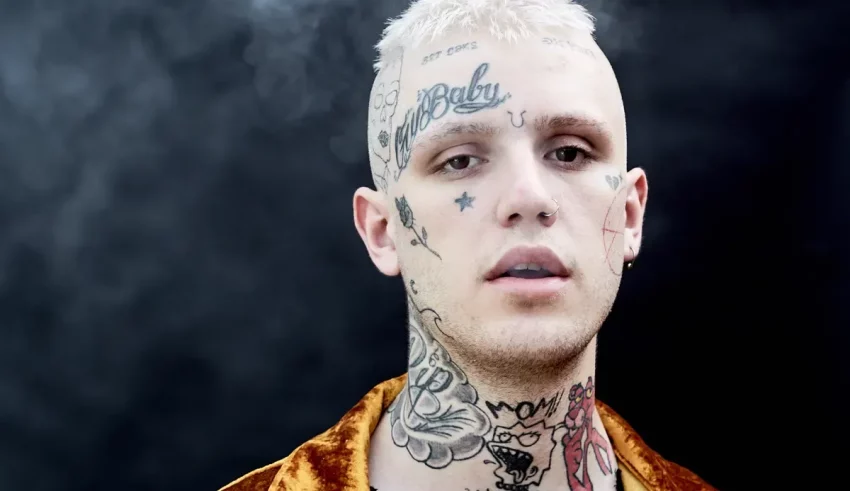 A man with tattoos on his neck.