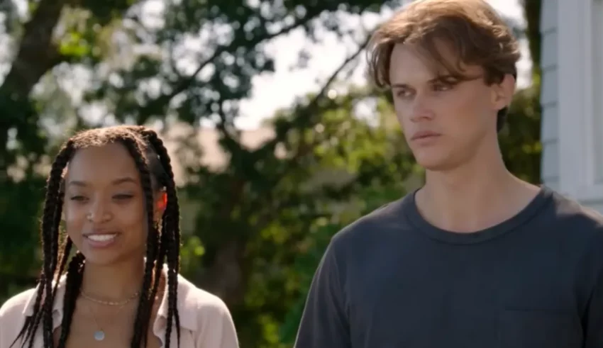 A young man and woman standing next to each other.