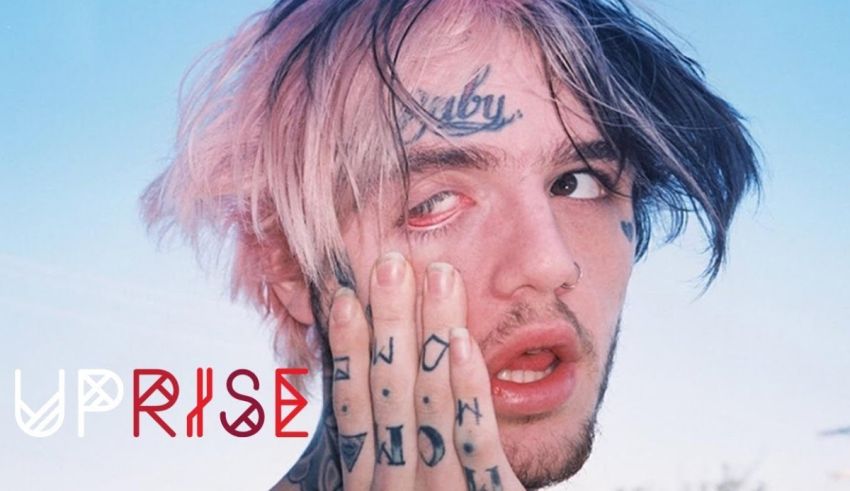 A young man with tattoos on his face.