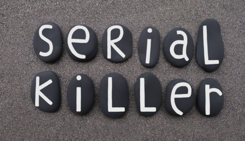 A black stone with the word serial killer written on it.