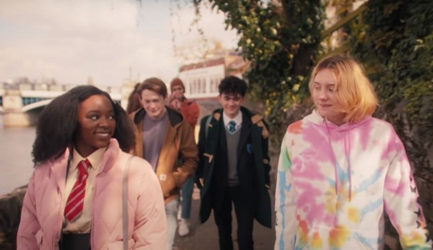 A group of people walking down a street.